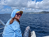 A researcher sitting on a boat, St. Thomas, USVI. Credit - Leslie Henderson/NOAA